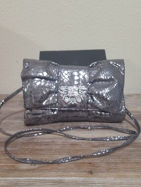 IMAN Metallic Silver Textured Crossbody Clutch with Crystal Brooch